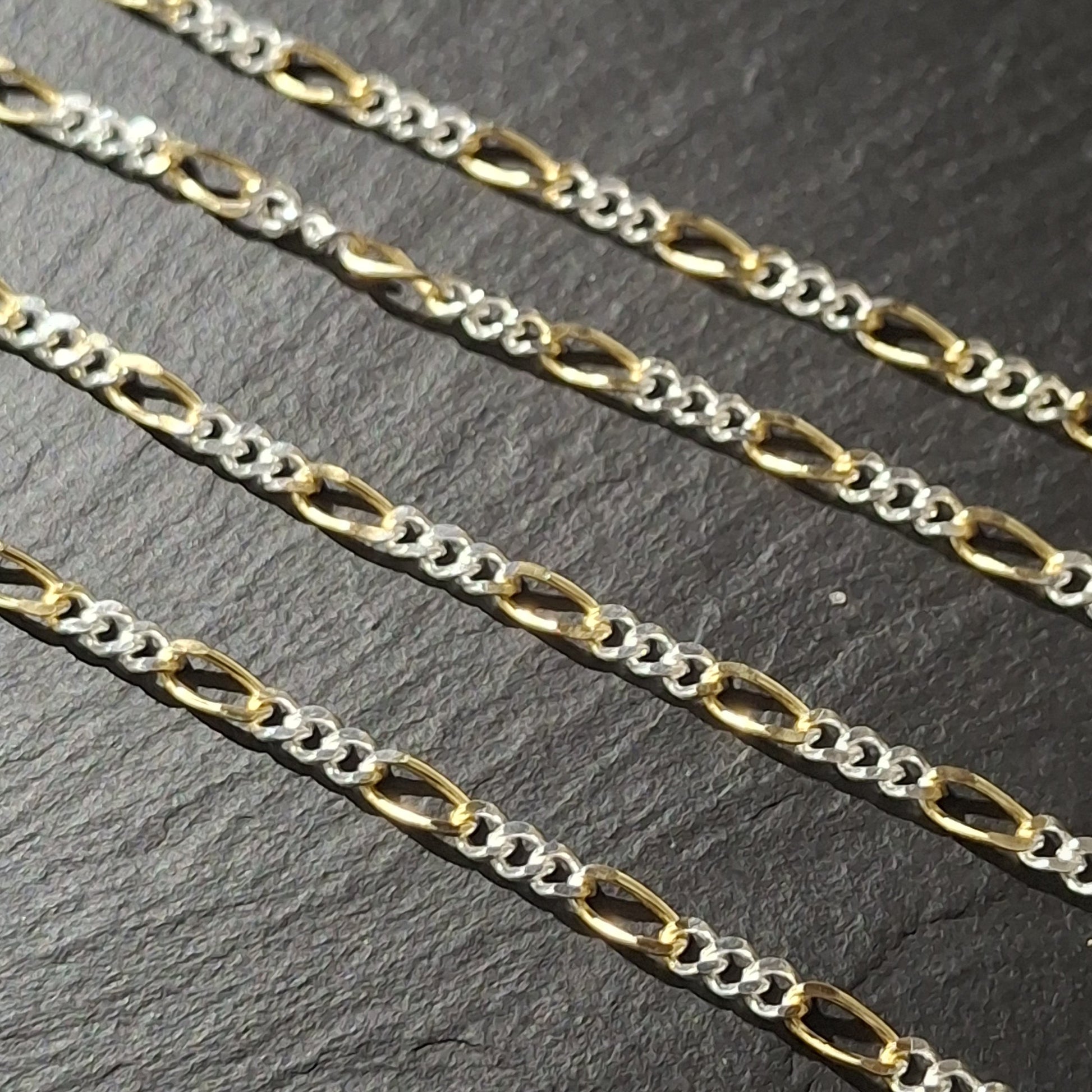 Wholesale display of mixed metal Figaro chains unfinished ready for jewellery making