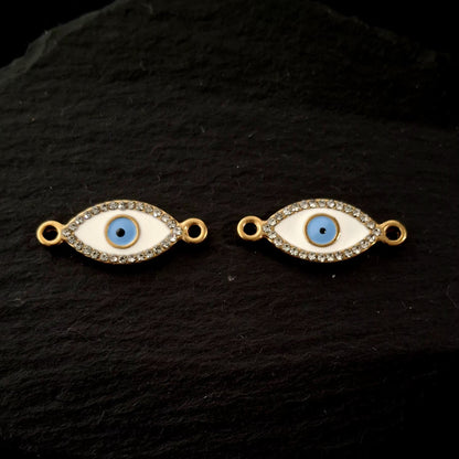 Evil eye bracelet connectors close up on a black hard surface SSAV 