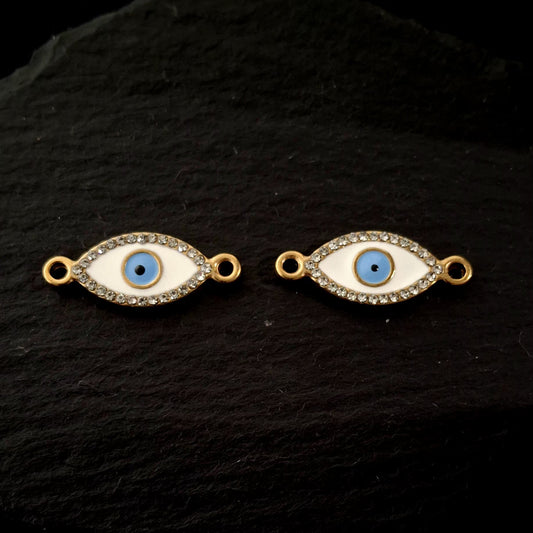 Evil eye bracelet connectors close up on a black hard surface SSAV 